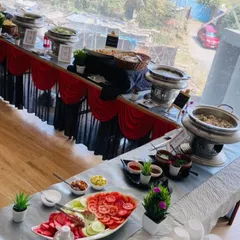 A full buffet line we set up for an Independence Day celebration. The menu includes a variety of Indian dishes, salads, and accompaniments, all professionally presented.
