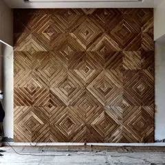 A work-in-progress shot of an intricate wooden feature wall for a drawing area. This geometric pattern, crafted from reclaimed wood, is designed to bring immense warmth and detailed texture to the space.