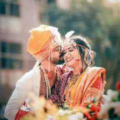 A sweet, candid moment as the groom whispers to his bride. These are the unscripted memories that make a wedding album truly special.