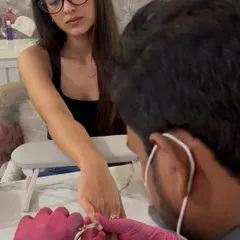 Here's a client getting her sculpted extensions. The process is meticulous and requires a high level of skill, but the comfortable and long-lasting result is completely worth it.