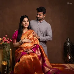 A classic seated portrait that showcases the beauty of the silk saree. The intricate details of the fabric and the traditional props create a rich, cultural feel.