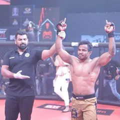 The moment of victory. A fighter I coached has his hand raised by the referee after a hard-fought win. This is what all the sacrifice and training is for.