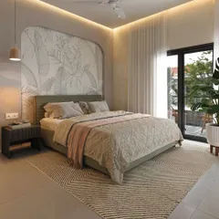 A wider view of the bedroom, showing the sage green upholstered bed and access to a private balcony, which fills the room with natural light.