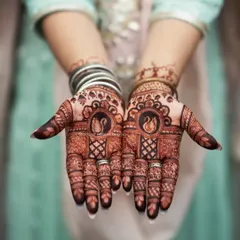 A professionally shot photo of a finished bridal design. The dark stain shows the quality of my henna, and the swan motifs are a classic choice for wedding functions.
