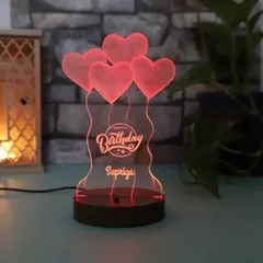 Wish someone a happy birthday with a personalized LED lamp designed just for them. This one features a festive balloon design and can be customized with the birthday person's name.