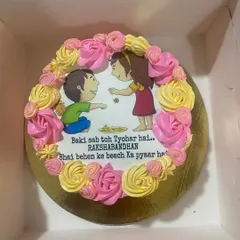 A special cake for Rakshabandhan, this one features an edible print of a brother and sister, surrounded by pink and yellow buttercream roses. It’s a sweet way to celebrate the sibling bond.