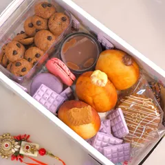 This is our limited edition Grazing Box, a perfect example of how we pack joy and indulgence for your special occasions. It includes a variety of our freshly made, 100% eggless delights like assorted bombolinis, cookie cereal, macarons, and stroopwafels, all ready to be shared.