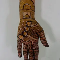 A beautiful backhand design featuring a temple dome, surrounded by delicate lotus flowers and fine-line patterns. This is a great choice for a traditional festival or ceremony.
