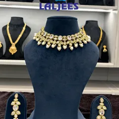 A simple and elegant kundan and pearl choker set. It's perfect for an engagement or sangeet look, and it's lightweight enough to wear comfortably for hours.