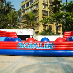 The 'Big Baller' inflatable is a challenging and hilarious game where participants try to cross by jumping over giant red balls.