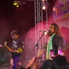 The vibe was electric at our Holi show in Pattaya. Here we are, covered in colors, sharing the energy with a massive crowd.