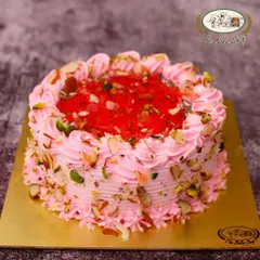 Inspired by the beloved dessert drink, our Falooda Cake is a party on a plate. It features layers of rose-flavored cake, sweet basil seeds, and jelly, all topped with crunchy nuts for a unique textural experience.