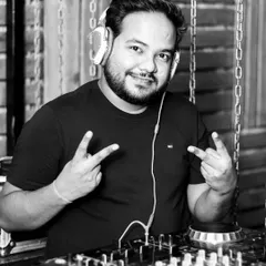 A simple, happy moment behind the DJ console. This is where I feel most at home, connecting with the crowd through music.
