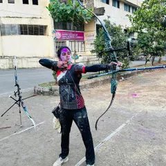 We believe in having fun too. Here's one of our archers celebrating Holi at the range, adding a splash of color to her practice session.