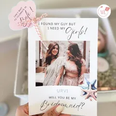 "I found my guy, but I need my girls!" A close-up of the personalized proposal card, which is the heart of this bridesmaid box, featuring a photo of the bride and her bestie.