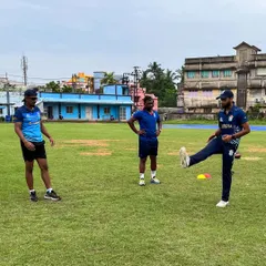Demonstrating a dynamic warm-up drill on the field. It's vital that athletes understand the purpose of each movement, so I often perform the drills with them to coach the finer points of technique and intent.