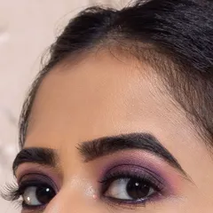 A macro shot focusing on a dramatic purple smokey eye. This shows the detail and precision that goes into my eye makeup application.