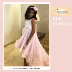 Here you can see the beautiful movement of the pink high-low gown. I design my dresses not just to look good standing still, but to create a wonderful visual effect when the child walks and twirls.