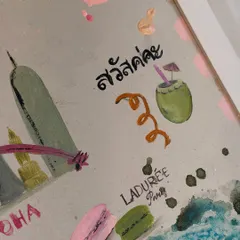 Details from a trip to Paris and Thailand, complete with macarons from Ladurée and a refreshing coconut drink. These tiny painted memories are what make a custom travel story canvas so special.