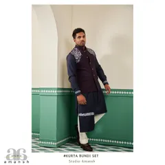 This angled view of the space blue bundi set highlights the detailed silver handwork on the shoulder and cuff, adding a touch of modern artistry to a traditional outfit.