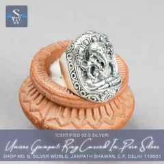 This unisex Ganpati ring features a bold, rectangular face with an intricately carved Lord Ganesha. Made from pure 92.5 silver with an oxidized finish, it is a powerful statement piece for devotees.