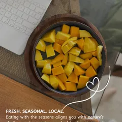 Fresh, seasonal, and local. Eating with the seasons, like enjoying this bowl of fresh mangoes, aligns us with nature's rhythm and supports our body's needs.
