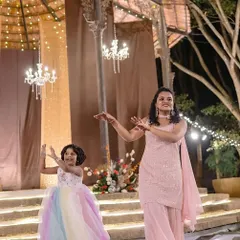 This little one is having a great time dancing with her mom. It's wonderful to see different generations sharing the dance floor.
