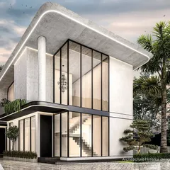 A close-up view of the Goa villa concept, detailing the double-height glass entryway and the smooth, rounded edges of the concrete structure.