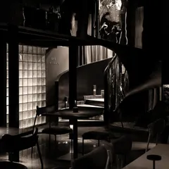 Mystery is a powerful tool in spatial storytelling. For this speakeasy, I designed a journey of concealment and revelation, where a spiraling staircase of black steel and distorted reflections guides patrons into a hidden world, making the arrival as compelling as the destination.