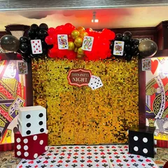 A "Teen Patti Night" setup with a casino theme, featuring a gold shimmer wall, giant playing card props, and oversized dice.