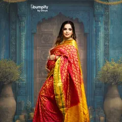 Celebrating motherhood with timeless tradition. This mom-to-be looks absolutely radiant in a vibrant red and gold Banarasi saree, posed against a classic, ornate blue doorway in my studio.
