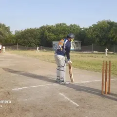 From the nets to the pitch. This is a snapshot from a Boys Under-14 weekly match, showing one of our batsmen ready at the crease. All our training is designed to prepare players for real match pressure.