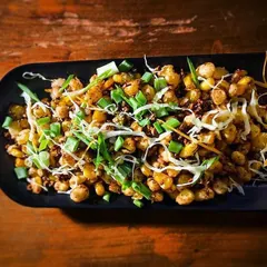 This is my Crispy Salt and Pepper Corn, a simple yet addictive dish. It's perfectly seasoned and fried until golden, making it a great vegetarian snack to go with your drinks.