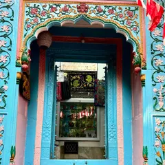 A beautifully preserved haveli doorway in Old Delhi, painted in vibrant shades of blue and pink. This is the kind of hidden architectural gem we love to show our guests on our 'Vanishing Havelis' walk.