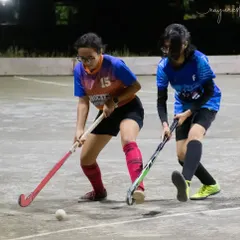 Two players in a one-on-one duel for the ball. These moments are crucial for developing individual skills and confidence.