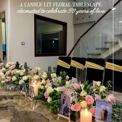 Celebrating 50 years of love is a milestone that deserves all the beauty. We designed this candle-lit floral tablescape with fresh pastel roses, eucalyptus, and personalized photo easels to tell their unique story. It’s the little details that turn a dinner into a cherished memory.