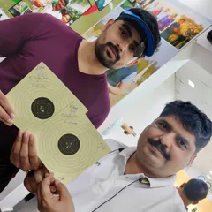 I am here with Rishabh Tyagi after he shot a perfect 100/100 in a practice session. Celebrating these milestones is an important part of our coaching process.