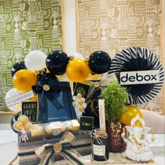We curated this bold black and gold themed hamper for a new office inauguration. It sets a tone of confidence and prosperity with a Ganesha idol for blessings, a live plant for growth, a personalized diary for new ideas, and the company's logo for a bespoke corporate touch.