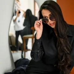 A behind-the-scenes glimpse into a fashion shoot. The mirror reflection adds a layer of depth to this cool and edgy portrait.