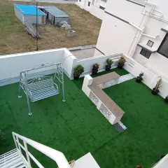 This is a complete rooftop transformation I completed, turning a bare terrace into a beautiful garden lounge. The project included installing pet-friendly artificial turf, a custom seating area, and a swing for relaxation.