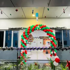 This large balloon arch in classic red, green, and white created a welcoming and festive entrance for a corporate building. An entrance arch is a great way to set the tone for your holiday event right from the start.