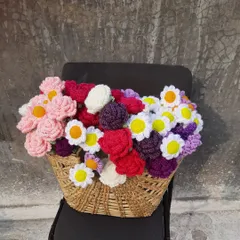 Another view of the flower basket, highlighting the different textures and colors of the crochet roses, daisies, and tulips. Each flower is crafted to be a lasting keepsake.