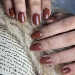 Chocolate brown nails are a sophisticated and elegant neutral. This glossy, rich brown gel polish is perfect for any season and adds a touch of class to your look.
