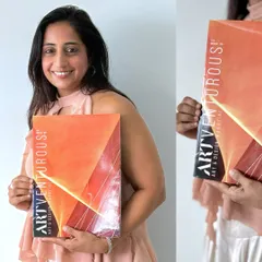 Holding the issue of Artventurous Magazine featuring my work. It's a wonderful feeling to see my art and story in print.