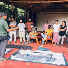 An instructor demonstrates how to properly pitch a tent during an outdoor leadership training program. We teach practical skills essential for any outdoor enthusiast.