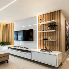 I used a mix of textures here, with vertical wood slats and a sleek white floating console. The open shelving provides a perfect spot for displaying decor.