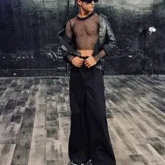 A full-body shot showcasing an edgy, all-black outfit with a leather jacket and mesh top. This look is perfect for a powerful Hip Hop or commercial performance.