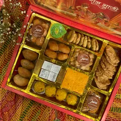 Let's take the traditional route this wedding season. This Bhaji Box is filled with classics like Kaju Katli, Motichoor Laddoo, and crispy mathri, making it a thoughtful return favour for your guests.