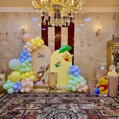 A classic Winnie the Pooh theme, perfect for a first birthday or baby shower. We used soft pastel balloons and character cutouts of Pooh and Tigger to bring the Hundred Acre Wood to this cozy home celebration.
