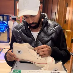 We had the opportunity to present Indian cricketer Hardik Pandya with his own custom Converse sneakers. He's seen here inspecting the final product, a moment that captures the personal and exclusive nature of our work.